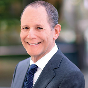 Lawyer smiles while posing for headshot photo