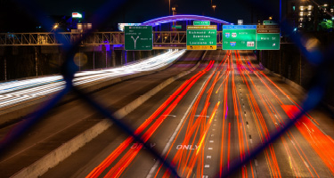 Busy interstate roadway with speeding cars