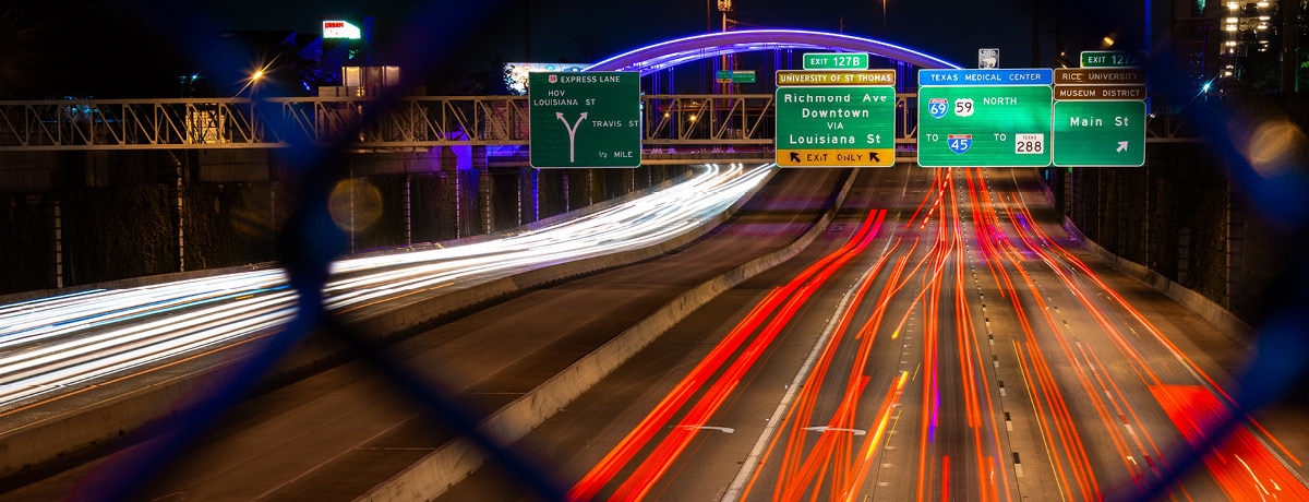 Busy interstate roadway with speeding cars