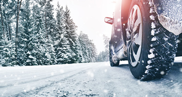 Car driving on snowy road