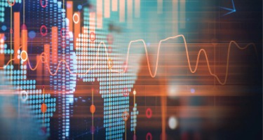 Image with blurred out dots on a screen with an orange graph line on the line