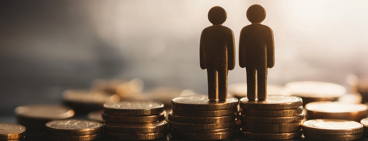 two figures standing on stacks of coins