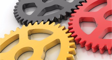 Red, black, and yellow Cogs turning with white background