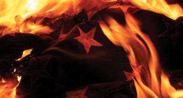 Blue navy flag with white stars on it with fire burning on it