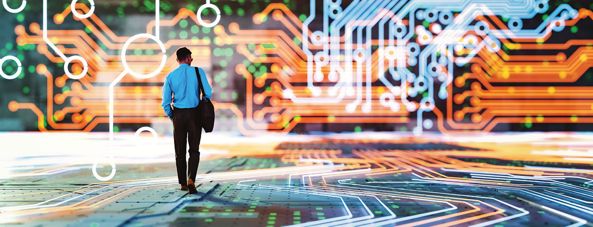 Man walking in frame with circuit board backdrop