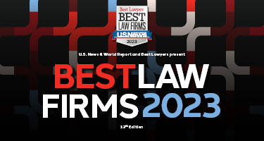 Red, white and blue pipes and writing on black background