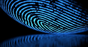 Blue fingerprint that's reflective with black background
