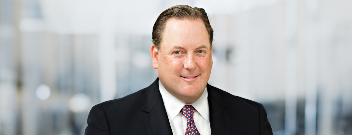 Man in suit posing for lawyer headshot