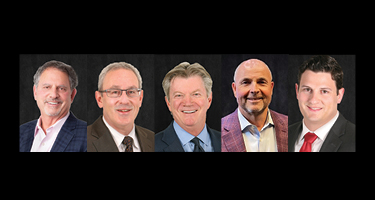 Lawyers pose for headshot with black background