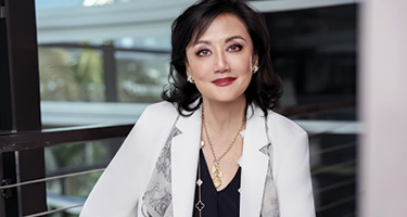 Deborah Chang posed in front of window