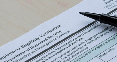 I-9 Immigration Form with pen