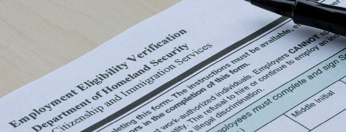 I-9 Immigration Form with pen