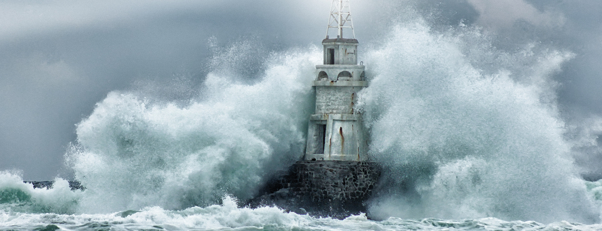Waves crashing into lighthouse