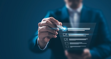 Figure in suit checks off an animated list