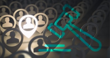 One person in the spotlight amongst a group of peers with a green gavel symbol