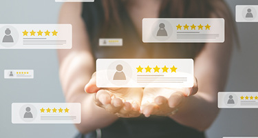 Woman holding blurb of online reviews