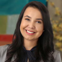 Headshot of female lawyer with long dark hair