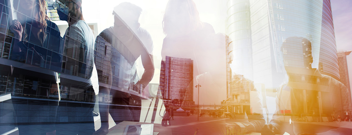 Shadows of people on a busy street and office buildings