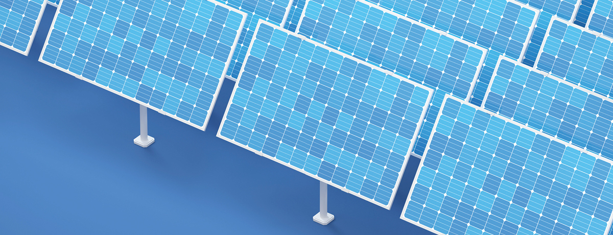 Blue solar panels lined up in front of blue backdrop