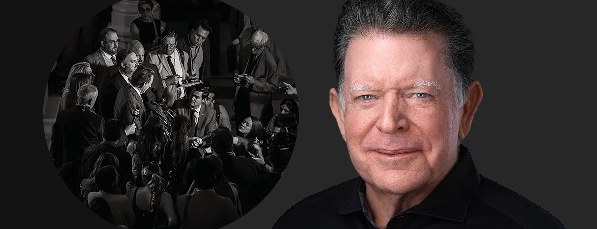 Dan Cogdell headshot on dark gray background