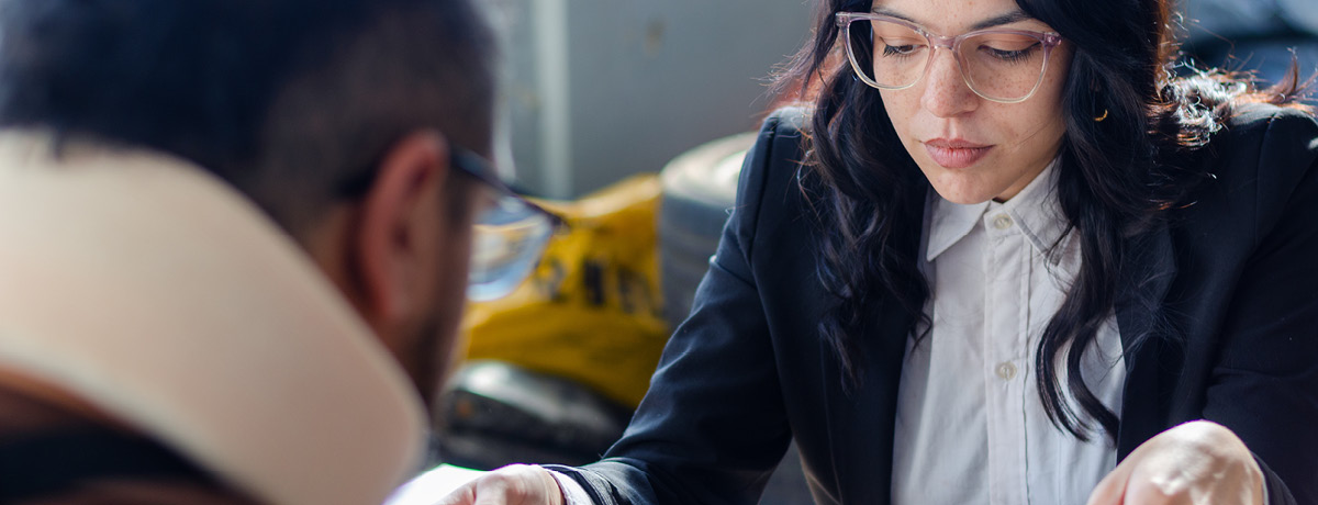 lawyer reviewing documents with client during personal injury consultation