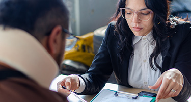 lawyer reviewing documents with client during personal injury consultation