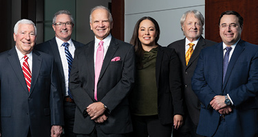 Group of lawyers pose for firm picture