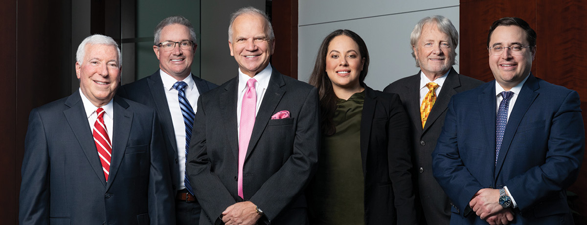 Group of lawyers pose for firm picture