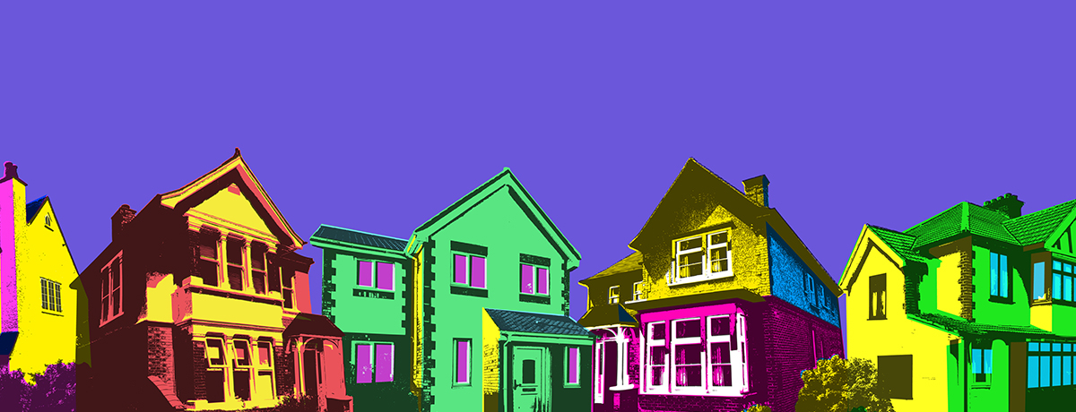 Multi-colored houses with purple backdrop
