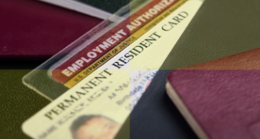 H-1B RFEs with an image of a man on a card with an employment authorization card behind it