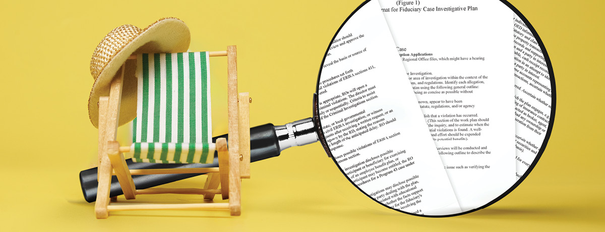 Beach chair and hat in front of large magnify glass