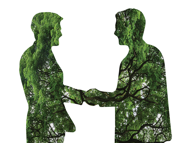 Trees fill two silhouettes shaking hands
