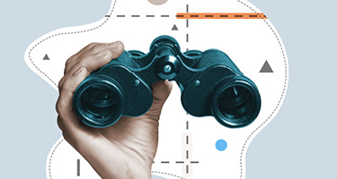 Hand holding binoculars scouts out law firms 