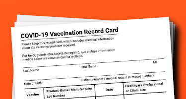 Close-up of COVID-19 Vaccination Card with a red background 