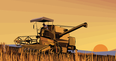 Man on tractor in open field