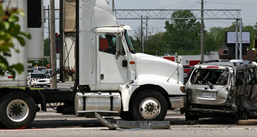 18-wheeler truck damages car in accident