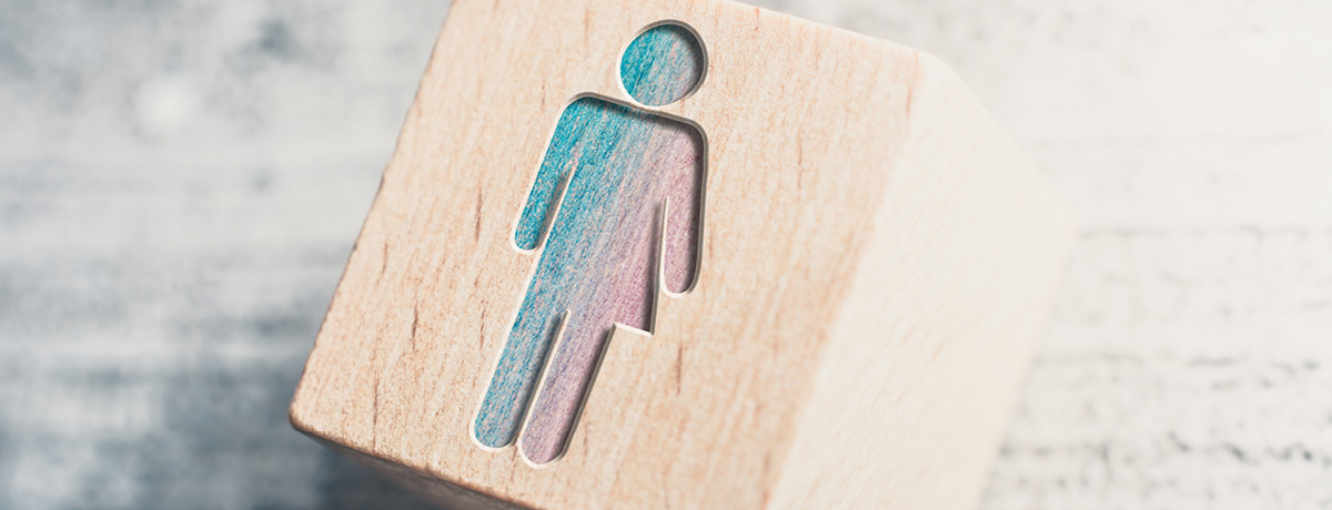 Wooden block with outline of male and female image