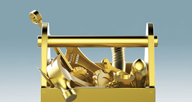 Gold plated toolbox with gold tools popping out of it