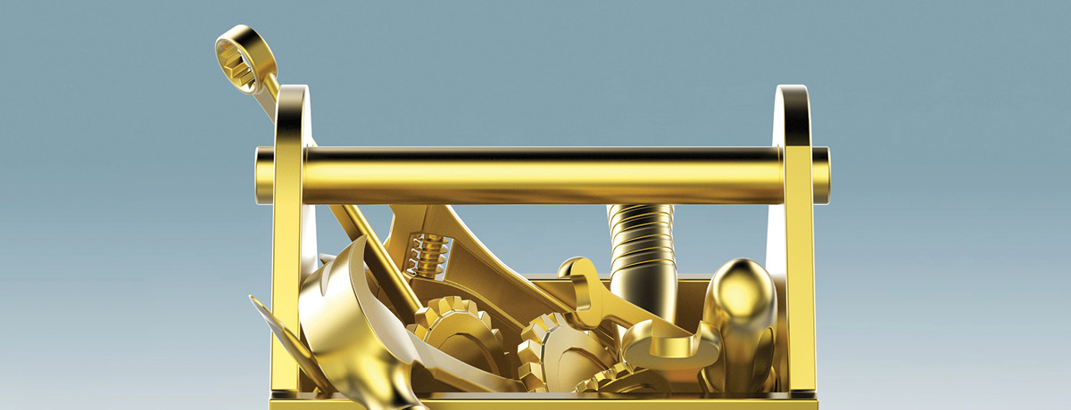 Gold plated toolbox with gold tools popping out of it