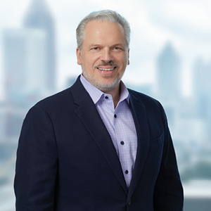 Lawyer wearing suit poses for headshot