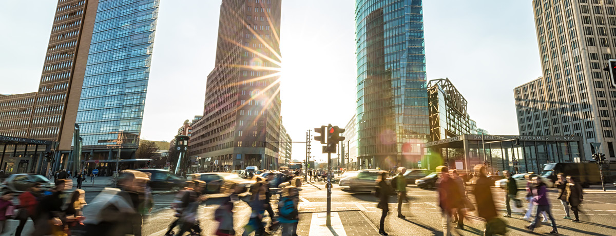 Skyline with people walking across street