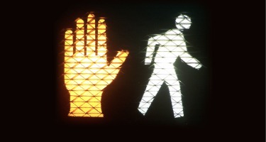 Cross Walk Sign with hand and person walking symbol lit