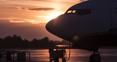 Airplane on Tarmac in the Sunset