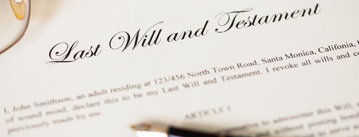Last will and testament document with pen and glasses