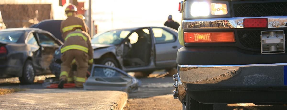 First responders assessing a car accident scene