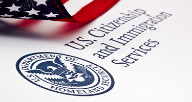 Department of Homeland Security logo with American flag in the backdrop
