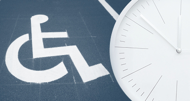 Image of wheelchair accessible sign white on blue background