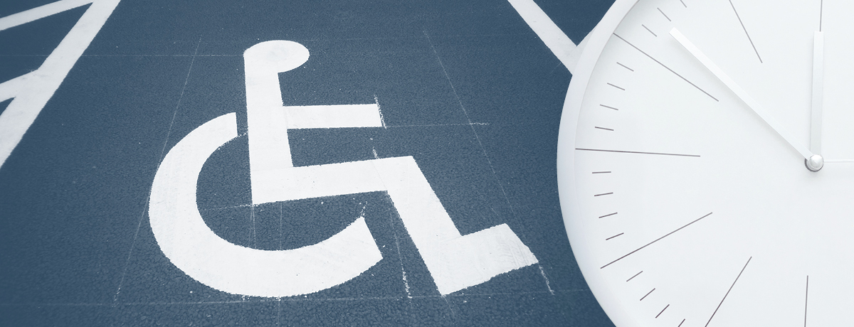 Image of wheelchair accessible sign white on blue background