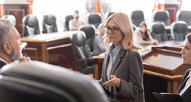 Blonde Woman Talking with White-Haired Man