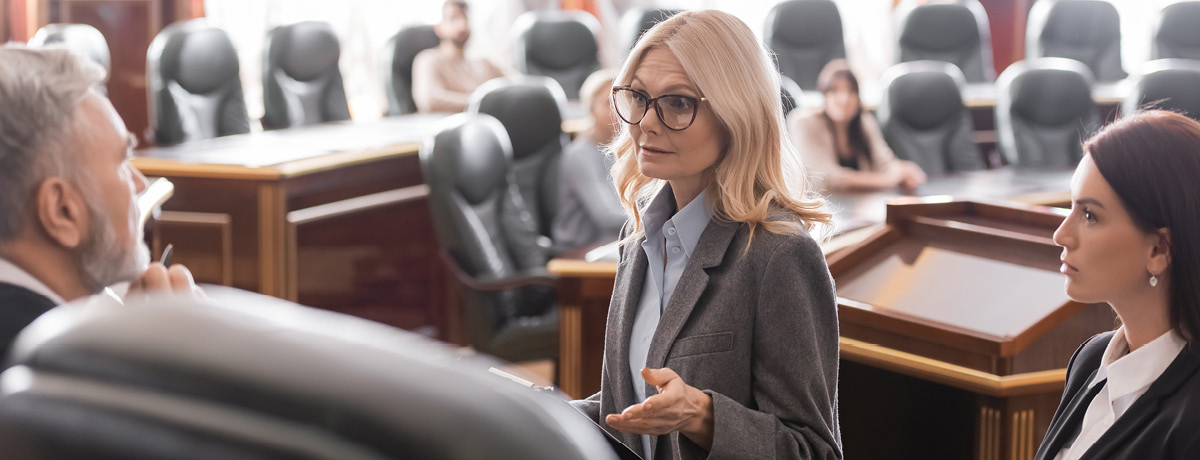 Blonde Woman Talking with White-Haired Man